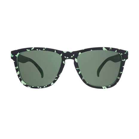 Front view of the Goodr What Lurks In The Shadows sunglasses with black and green speckled frames