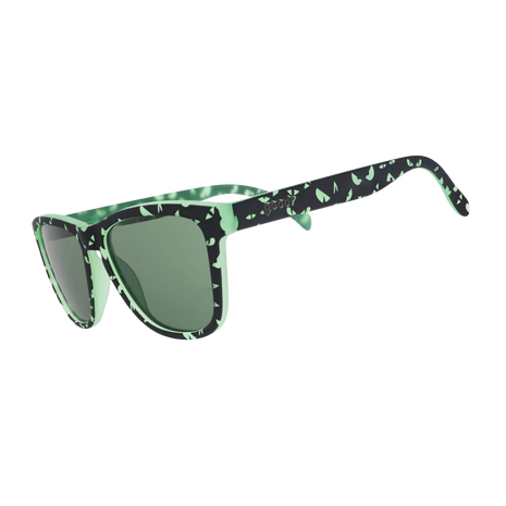 Goodr What Lurks In The Shadows sunglasses, side view of black frames with green eye print and grey lenses