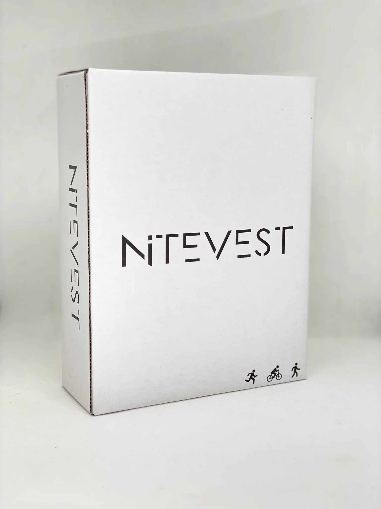 Rechargeble LED Safety Vest by NiteVest in white packaging for running and cycling safety with 360-degree illumination and chest light