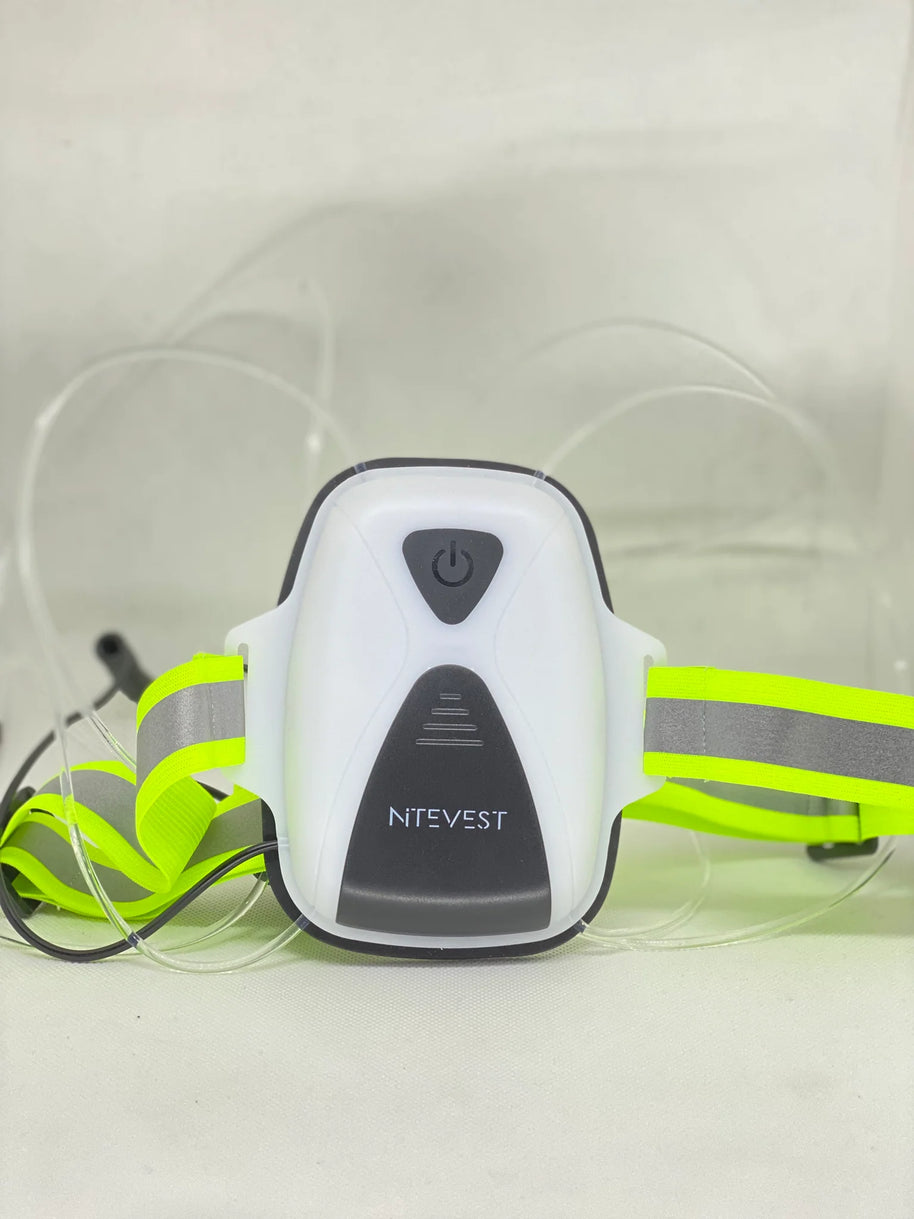 Rechargeble LED Safety Vest by NiteVest in yellow with reflective grey stripes, featuring 360-degree illumination and 150 lumen chest light for outdoor safety.