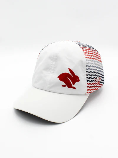 Elite Hat by Rabbit in white with red and blue patterned panels, lightweight-wicking cap with laser-cut vents, ideal for sun protection and outdoor use
