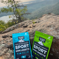 Sport Wipes by Outdoor Wipes in blue and green XL packs, body care wipes for camping, running, and outdoor use without showers
