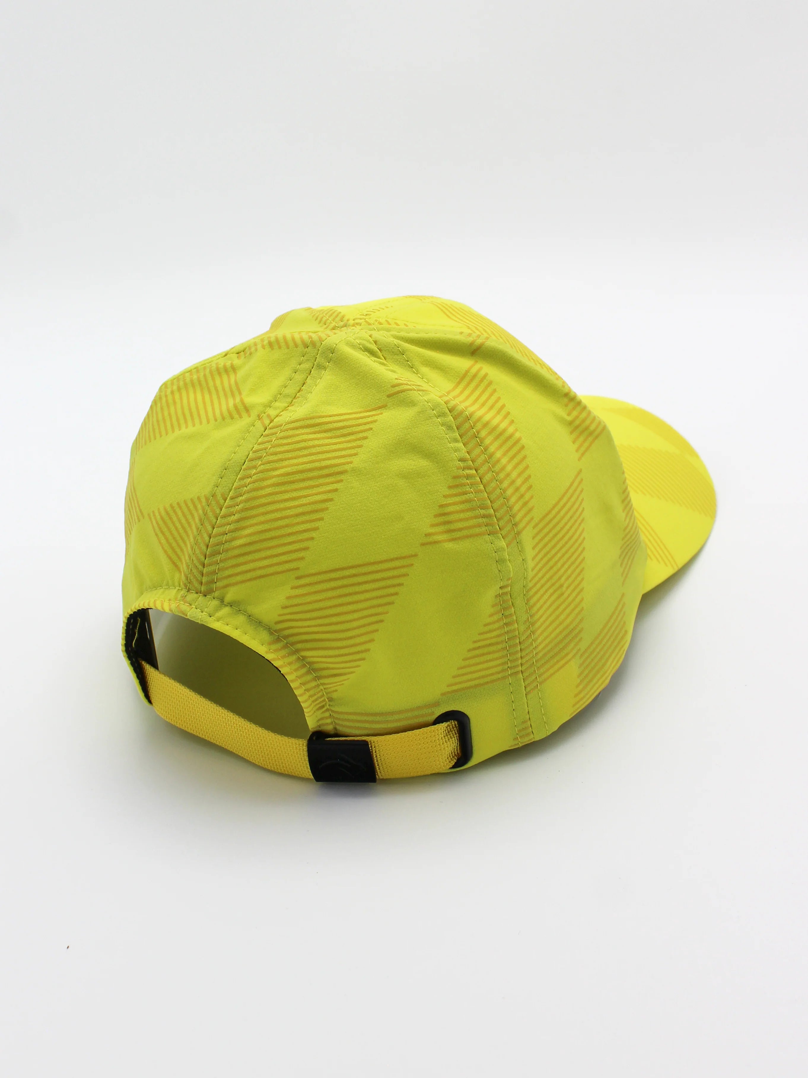 Low Light Tech Cap by Rabbit in bright yellow with reflective details, designed for visibility and safety in low light conditions