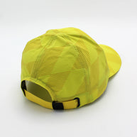 Low Light Tech Cap by Rabbit in bright yellow with reflective details, designed for visibility and safety in low light conditions