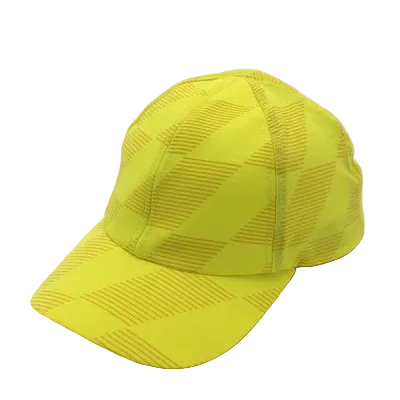 Low Light Tech Cap by Rabbit in bright yellow with reflective pattern, designed for visibility and safety in dark conditions.