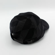 Low Light Tech Cap by Rabbit in black with reflective geometric pattern, adjustable fit, designed for visibility in low light running and outdoor use