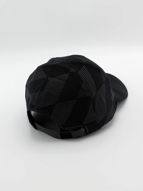 Low Light Tech Cap by Rabbit in black with reflective geometric pattern, adjustable fit, designed for visibility in low light running and outdoor use
