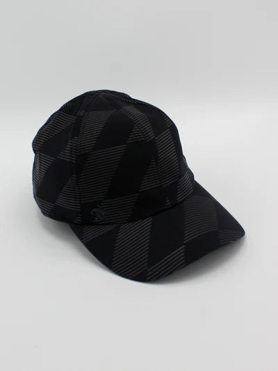 Low Light Tech Cap by Rabbit in black with subtle check pattern, designed for visibility and safety in low light conditions