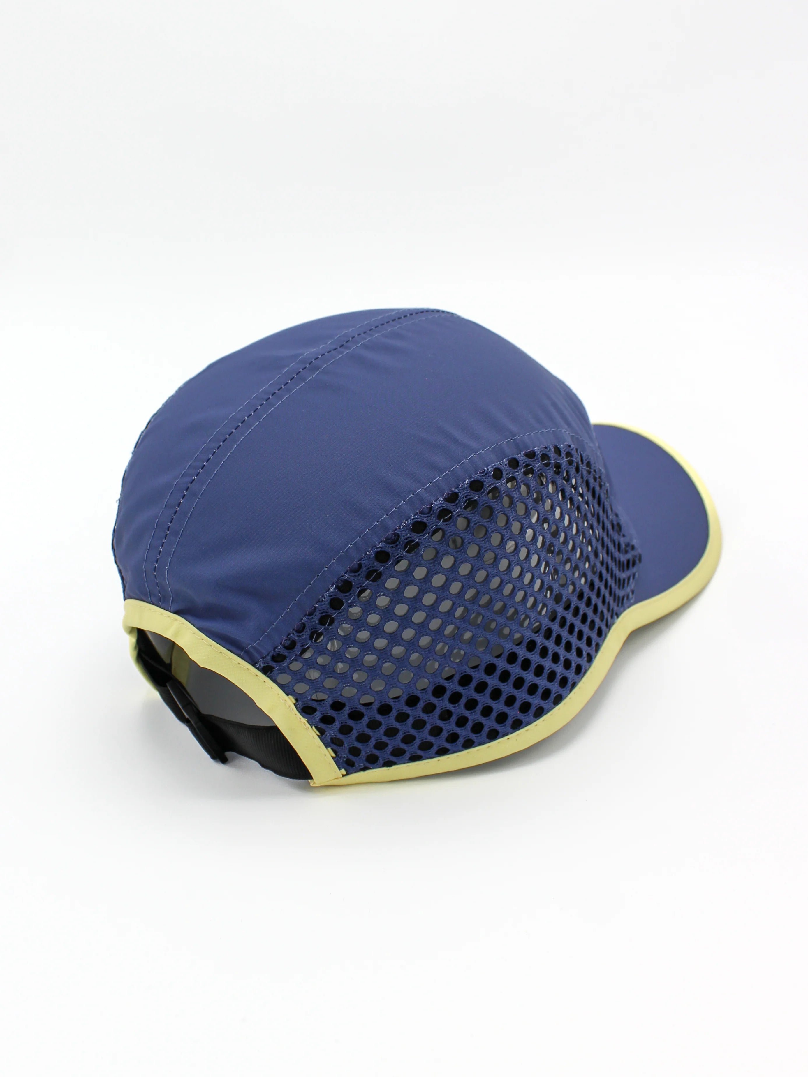 Run Hat Vent Mesh by Rabbit in navy and pale yellow, lightweight wicking polyester with ventilator mesh for cool, dry running protection