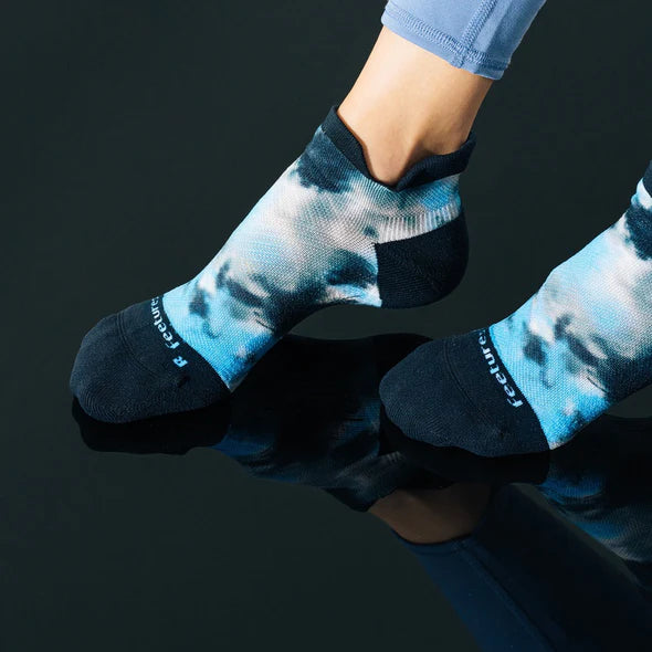 Elite Light Cushion No Show Tab Limited Edition Tie Dye - Women by Feetures in blue and black with anatomical design and targeted compression for running
