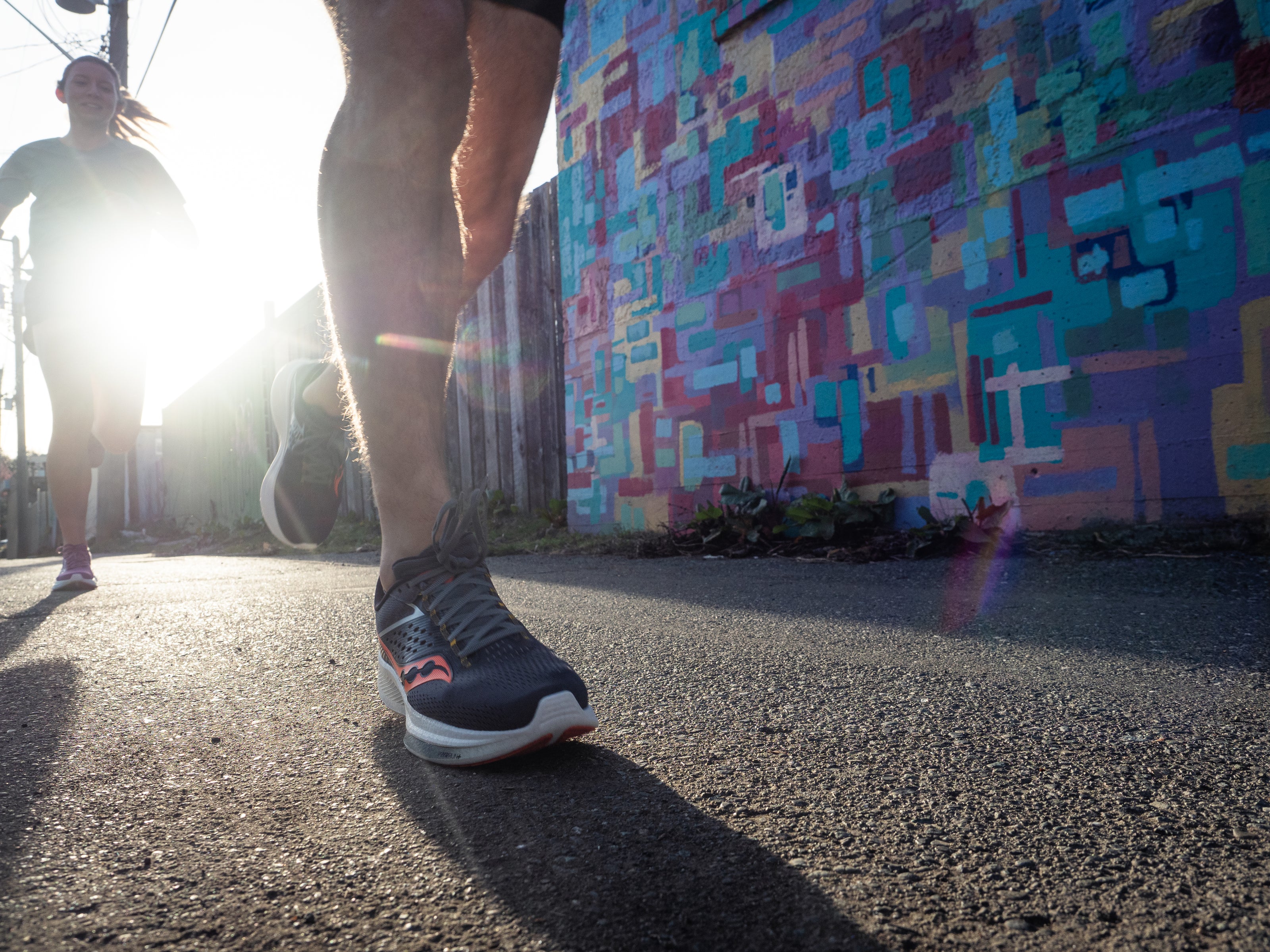 Ride 17 - Women by Saucony in navy and coral with PWRRUN+ cushioning designed for comfortable road running and everyday use