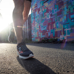 Ride 17 - Women by Saucony in navy and coral with PWRRUN+ cushioning designed for comfortable road running and everyday use