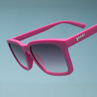 Close-up of the Goodr Living Highlight Reel magenta sunglasses showing the white goodr logo on the arm