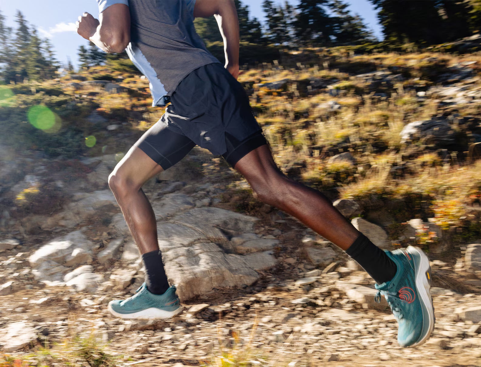 Ultraventure 4 - Men by Topo Athletic in teal and orange lightweight trail running shoe with plush platform for rugged outdoor use