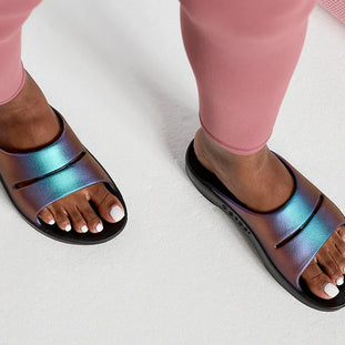 OOahh Luxe - Women by Oofos in iridescent blue and purple slides with agile OOfoam strap for support and comfort in casual wear