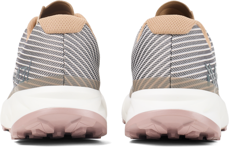 Back view of a pair of NNormal Kjerag trail running shoes in Beige showing tan heels and pink outsoles
