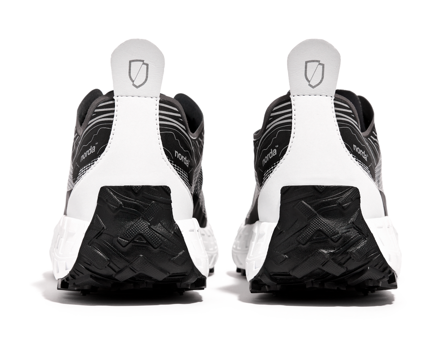 001 Core - Women by Norda in black and white with seamless Bio-Dyneema upper and Vibram sole for lightweight trail running in Canada