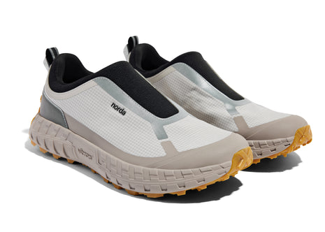 003 - Women by Norda in beige and black laceless approach shoe with Vibram soleplate for hiking, scrambling, and trail running