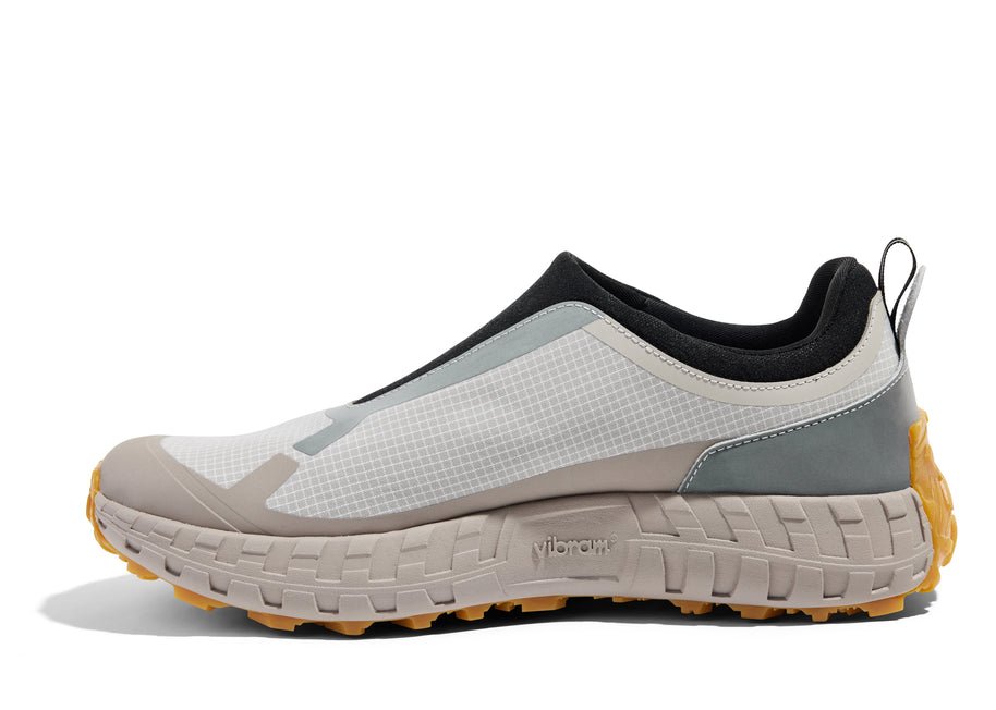 003 - Women by Norda in white, beige, and grey laceless approach shoe with Vibram sole, durable for hiking, scrambling, and running