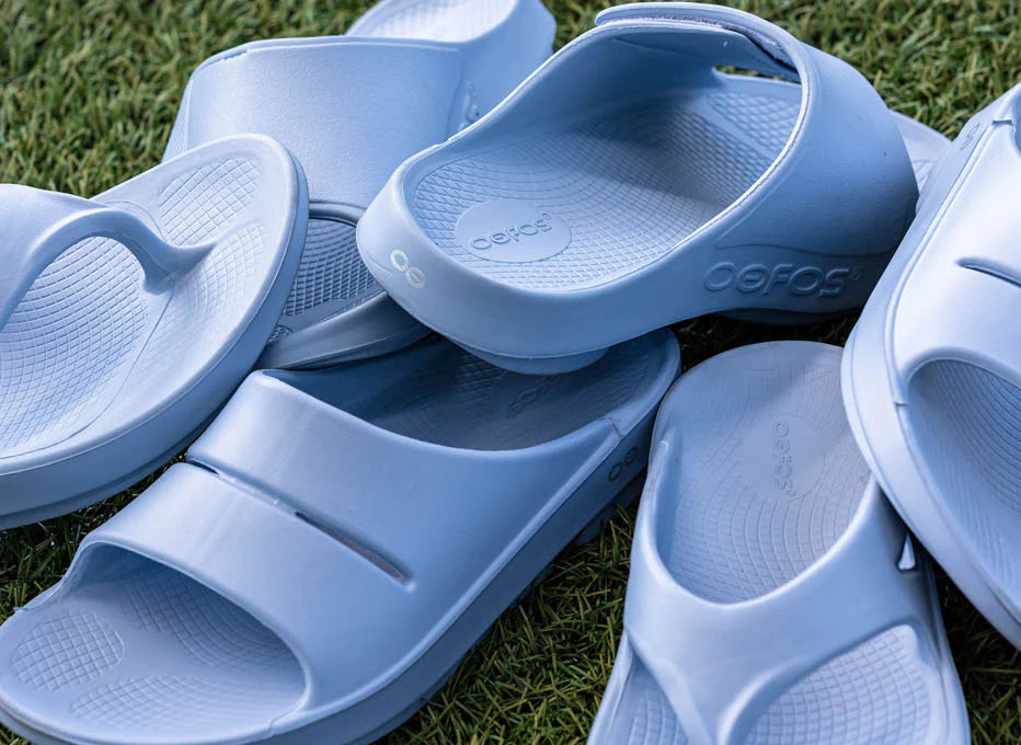OOriginal - Unisex by Oofos in light blue, recovery slides with OOfoam technology for comfort and support after running or outdoor use