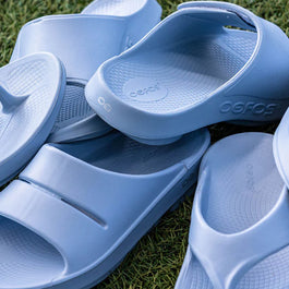 OOriginal - Unisex by Oofos in light blue, recovery slides with OOfoam technology for comfort and support after running or outdoor use