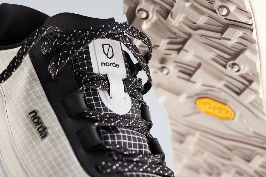 002 Core - Men by Norda in black and beige trail running shoe with bio-based Dyneema®, low stack height, and durable sole for technical terrain in Canada
