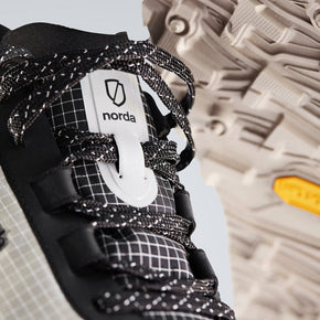 002 Core - Men by Norda in black and beige trail running shoe with bio-based Dyneema®, low stack height, and durable sole for technical terrain in Canada
