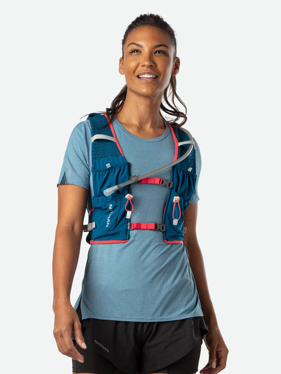 Vapor Airess 2 Lite 4L by Nathan in blue with red accents, lightweight breathable mesh running pack with adaptive-fit hook loop design for trail running