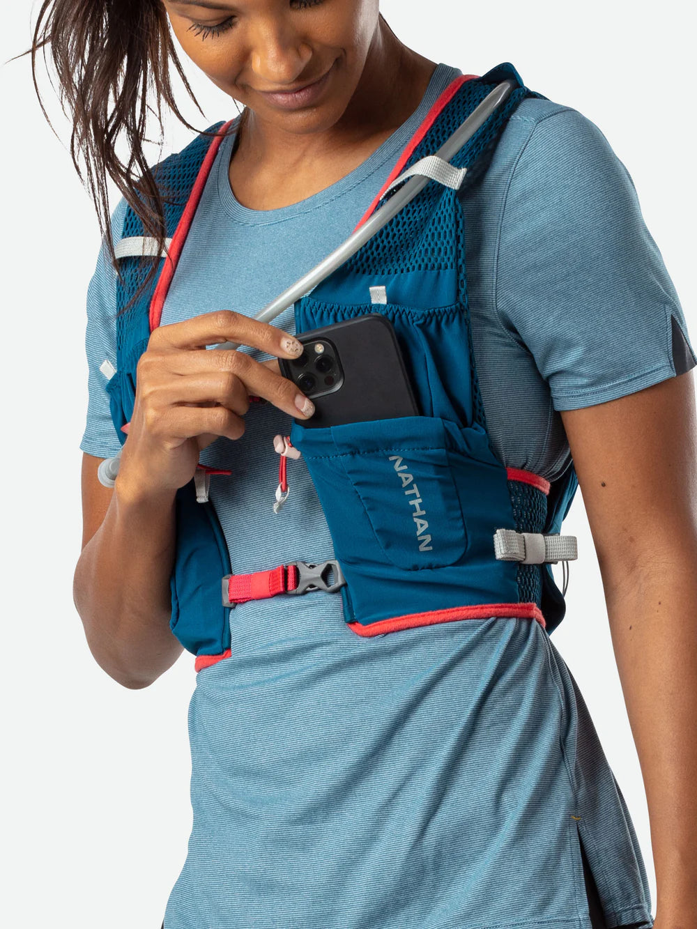 Vapor Airess 2 Lite 4L by Nathan in blue with red trim, lightweight breathable mesh running vest with adaptive-fit hook loop design
