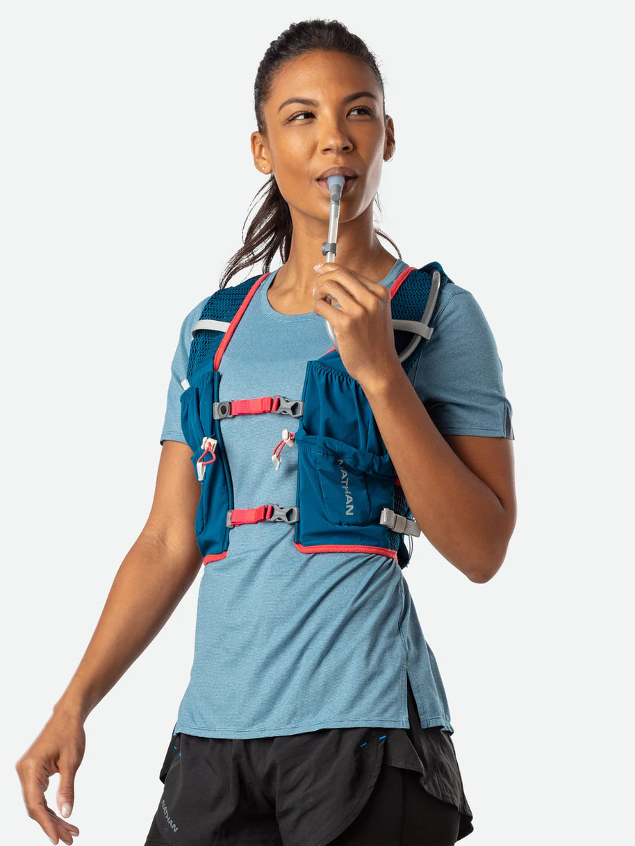 Vapor Airess 2 Lite 4L by Nathan in blue with red accents, lightweight breathable running pack with Adaptive-Fit and hook loop design for hydration