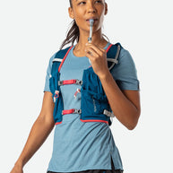 Vapor Airess 2 Lite 4L by Nathan in blue with red accents, lightweight breathable running pack with Adaptive-Fit and hook loop design for hydration