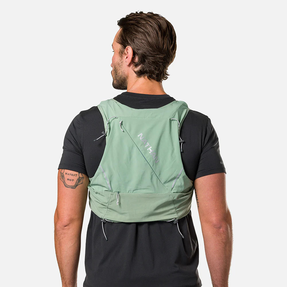 Pinnacle Pro 12L - Men by Nathan in green with slider sternum cords and Quick-Fit™ system for running and outdoor use