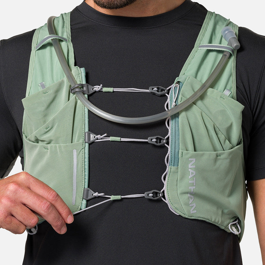Pinnacle Pro 12L - Men by Nathan in sage green with Quick-Fit adjustment and slider sternum cords for running hydration and fit
