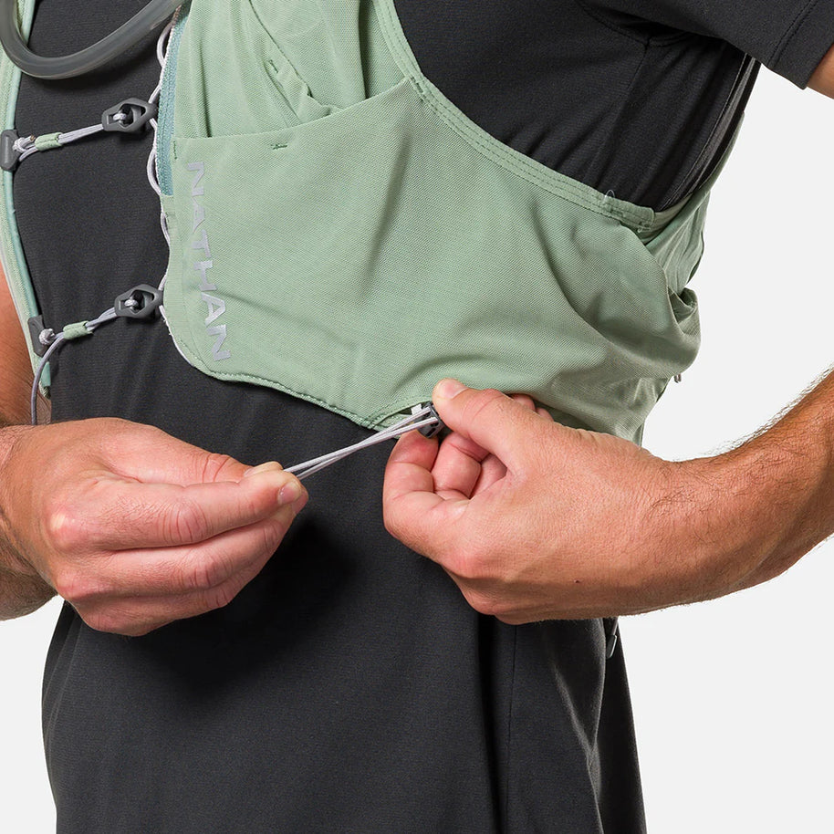 Pinnacle Pro 12L - Men by Nathan in light green with slider sternum cords and Quick-Fit™ system for adjustable running vest fit