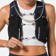 Pinnacle Pro 12L - Women by Nathan in black and purple with slider sternum cords and Quick-Fit system for running comfort and fit adjustment
