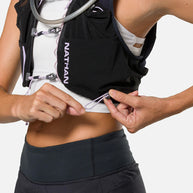 Pinnacle Pro 12L - Women by Nathan in black with slider sternum cords and Quick-Fit adjustment system for running and outdoor use