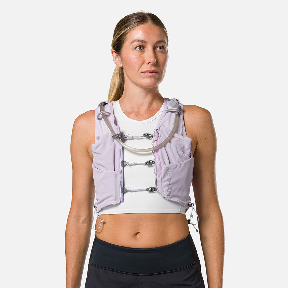 Pinnacle Pro 12L - Women by Nathan in light purple with slider sternum cords and Quick-Fit system for running and outdoor use