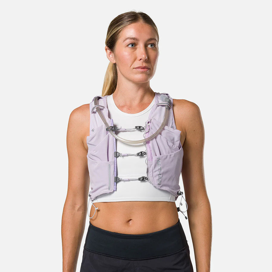 Pinnacle Pro 12L - Women by Nathan in light purple with slider sternum cords and Quick-Fit system for running and outdoor use