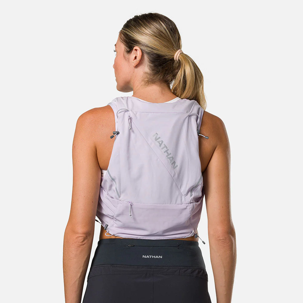 Pinnacle Pro 12L - Women by Nathan in light purple with slider sternum cords and Quick-Fit system, lightweight running vest ideal for outdoor use