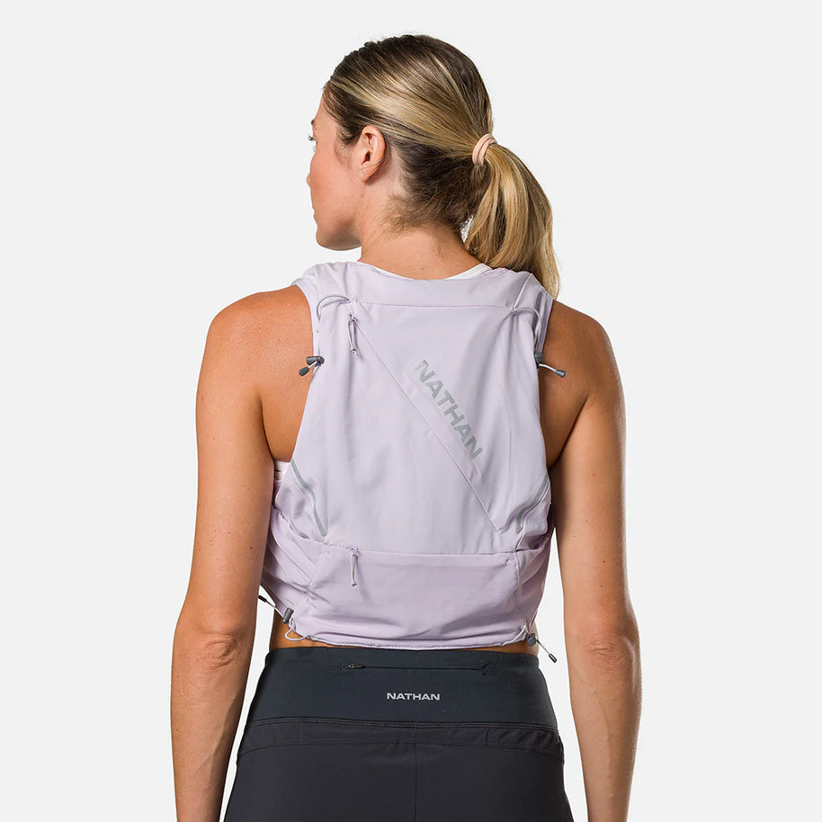Pinnacle Pro 12L - Women by Nathan in light purple with slider sternum cords and Quick-Fit system, lightweight running vest ideal for outdoor use