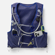 Nathan Pinnacle Pro 12L women's vest in Indigo/Light Blue, front pockets loaded with phone, keys and gear