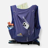 Nathan Pinnacle Pro 12L women's vest in Indigo/Light Blue, back pocket holding a map, phone and poles