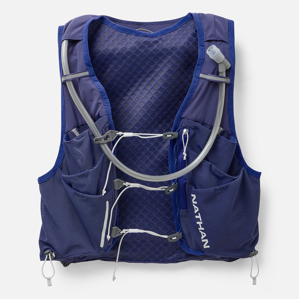 Nathan Pinnacle Pro 12L women's running vest in Indigo/Light Blue, front view with soft flasks and tubes