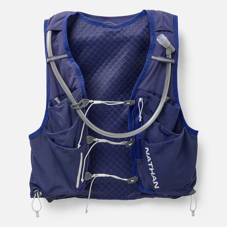 Nathan Pinnacle Pro 12L women's running vest in Indigo/Light Blue, front view with soft flasks and tubes