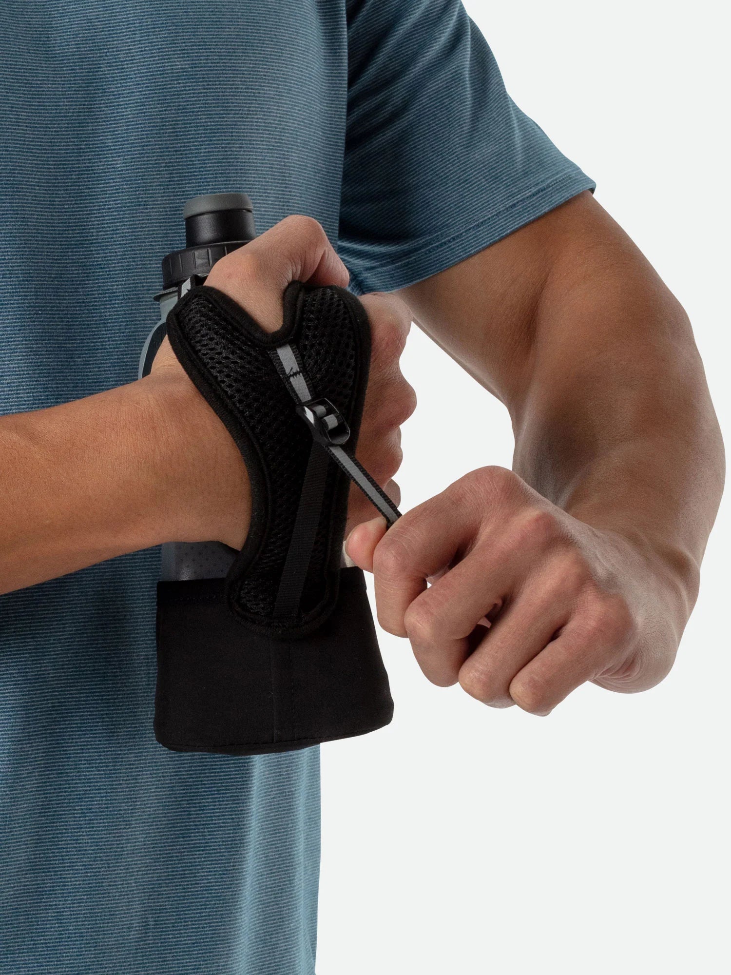 Quick Squeeze Lite 12oz Insulated Handheld by Nathan in black with adjustable strap, lightweight and easy to squeeze for running hydration