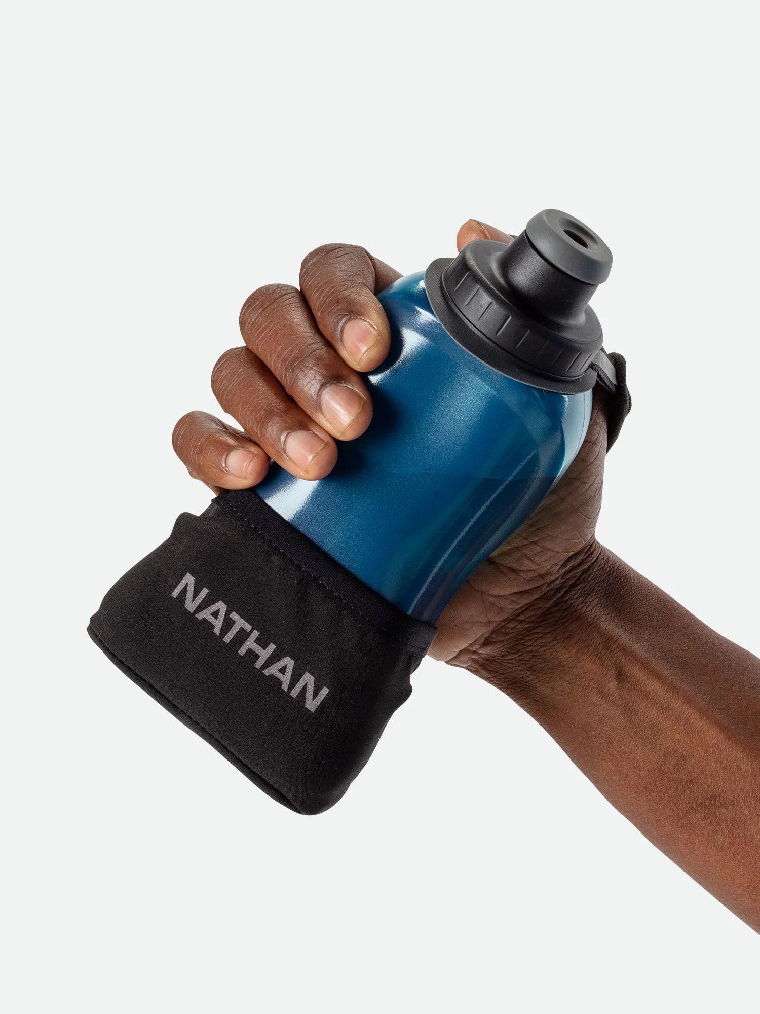 Quick Squeeze Lite 12oz Handheld by Nathan in blue with black adjustable strap, lightweight, easy to squeeze hydration flask for running store use