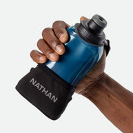 Quick Squeeze Lite 12oz Handheld by Nathan in blue with black adjustable strap, lightweight, easy to squeeze hydration flask for running store use