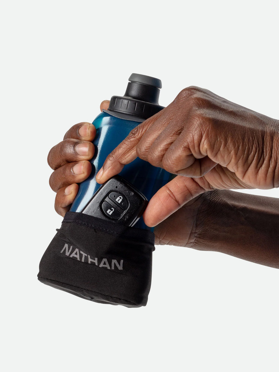 Quick Squeeze Lite 12oz Handheld by Nathan in blue with black strap, lightweight hydration flask with adjustable no-slip grip ideal for running