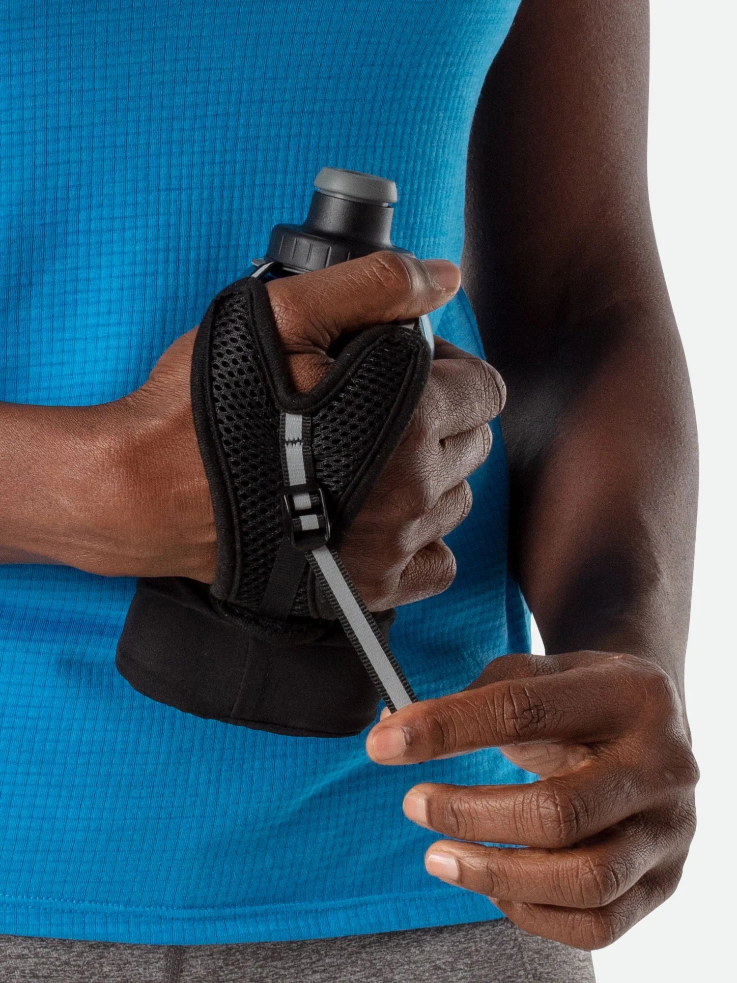 Quick Squeeze Lite 12oz Handheld by Nathan in black with adjustable strap and no-slip insert, lightweight hydration for running and outdoor use