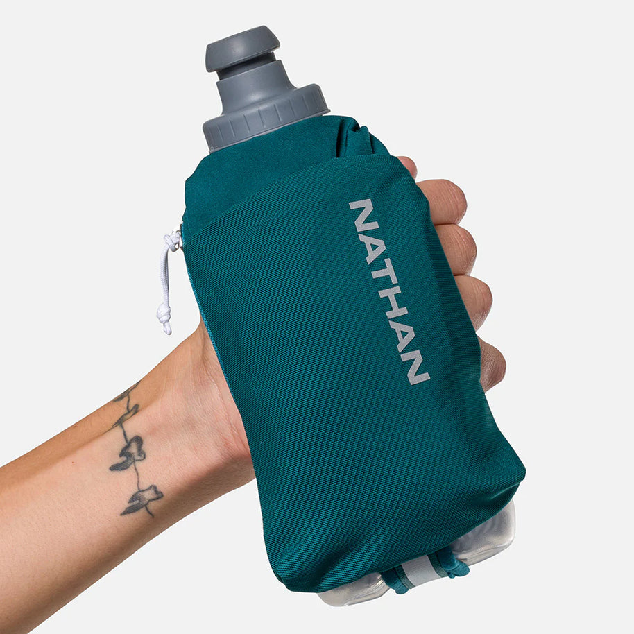 Handheld Nathan Speed Draw 2 12oz Insulted Flask in teal with updated shape, power mesh pocket, and insulation to keep fluids cool longer for running.